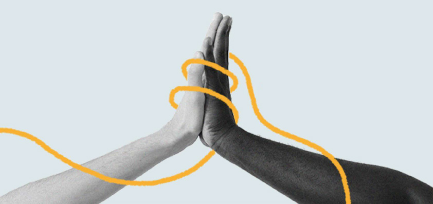 Imagen ilustrativa de duas mãos juntas